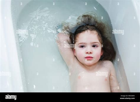 Little Girl Swimming In The Bathroom Portrait Of Baby Bathing In A