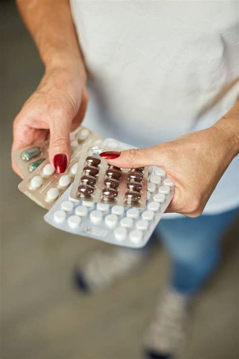 mature woman hold in hand blister pack of pills stock image image of female care 236948891