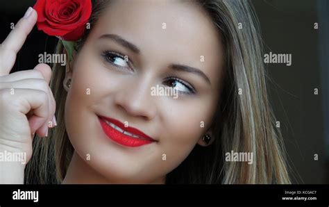 Young Woman With Red Rose Stock Photo Alamy