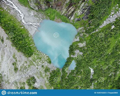 An Aerial View Of The Beautiful Mountain Lake With Turquoise Water