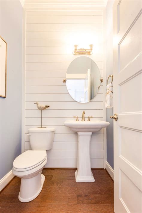 Try painting your half bathroom a dark color and accenting it with pops of metallic frames and colorful images. Stephen Alexander Homes & Neighborhoods | Half bathroom ...