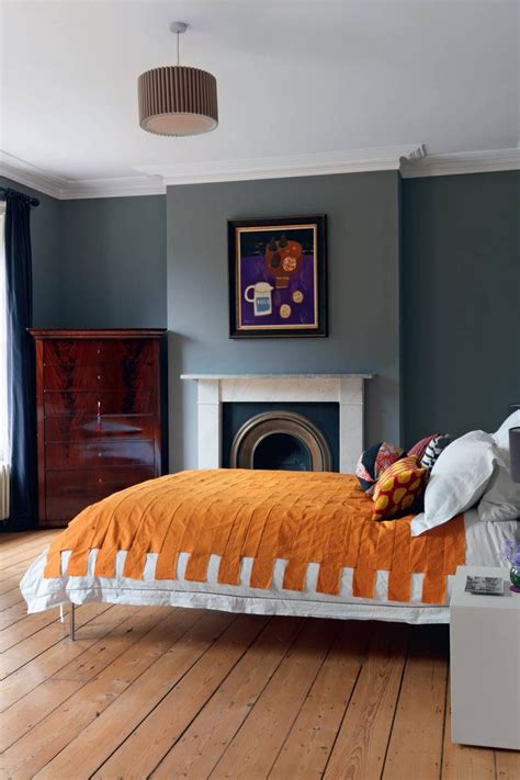 Painting the entire room in a bold orange will make the room feel smaller and more. Inside the homes of interior designers | Bedroom orange ...