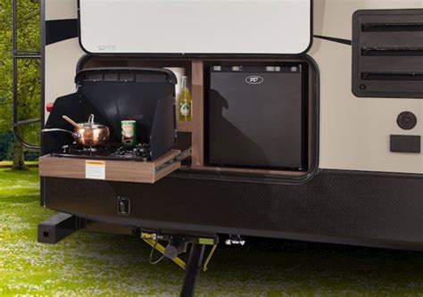 He built an outdoor kitchen that mounts to the side of the camper. Outdoor Kitchens for Your RV