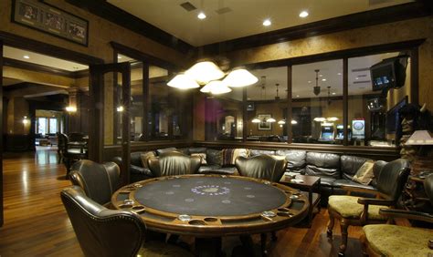 A classy game room with a billiards pool and a bar under the ceiling with beams lighted by beautiful pendant lights and wall. HD photo of game room, wallpaper of games room, poker ...