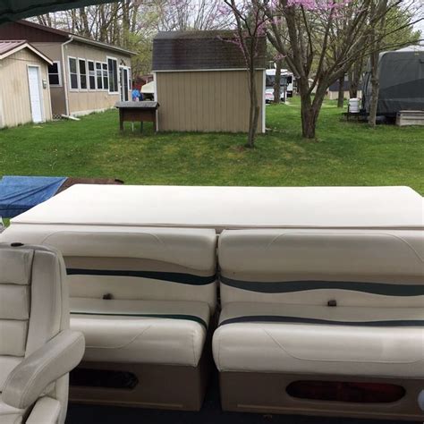 The Inside Of A Boat With Two Seats In Front Of It And A Trailer Behind It