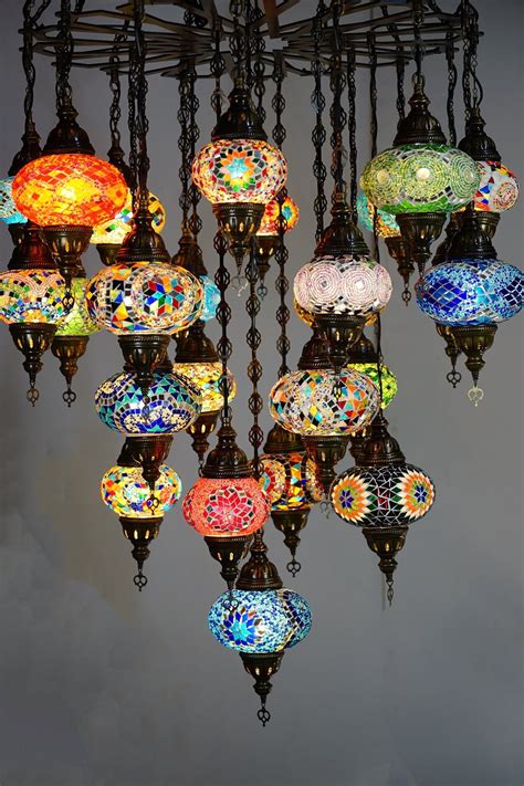 The first method is to create a single piece of mosaic art and cut it up between the tiles. 25 piece Mosaic Chandelier | The Dancing Pixie