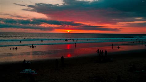 Beautiful Red Sunset By The Sandy Beach Wallpaper Beach