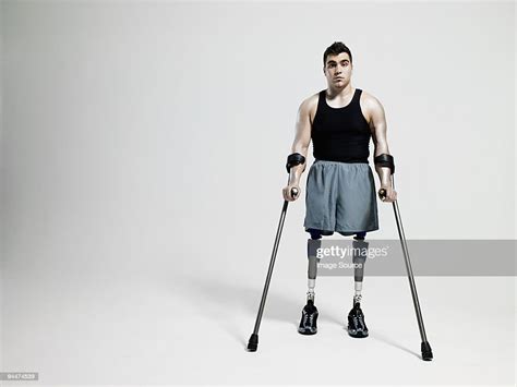Man With Crutches And Prosthetic Legs High Res Stock Photo Getty Images