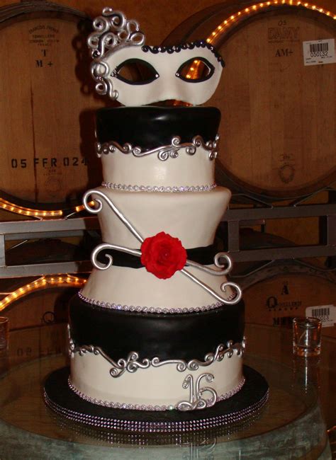 masquerade cake made to celebrate a sweet 16 a black and white themed party for the girl in red