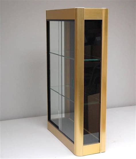 You may want to consider using one of the following: Gold Colored Wall Display Cabinet or Vitrine with Sliding ...