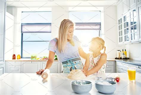 Loving Mother And Daughter Baking In The Kitchen High Quality People