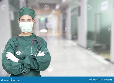Asian Women Surgeon Doctors With Stethoscope Wear Mask At Hospital