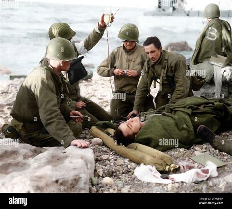 A Captain And Medics Treated A Wounded Soldier Of The 1st Us Infantry