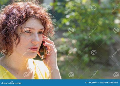 Young Redhead Woman Talking On The Phone Outdoors On A Sunny Day Stock Image Image Of Redhead