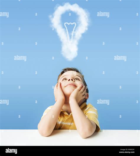 Little Kid Dreaming About A Light Bulb Stock Photo Alamy