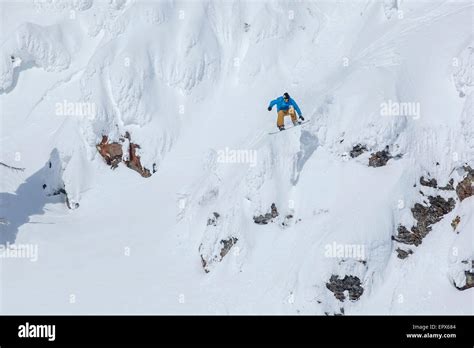 Usa Montana Whitefish Man Snowboarding Down Mountain Stock Photo Alamy