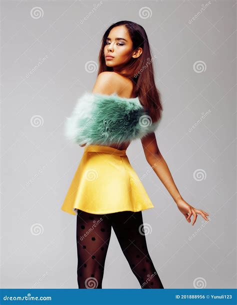 Young Pretty African American Woman Posing In Fashion Clothers