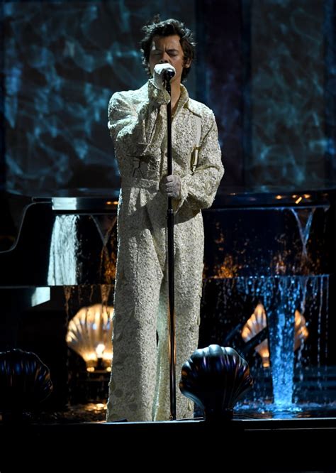 harry styles performing at the 2020 brit awards harry styles s lace gucci jumpsuit at the 2020