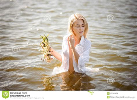 Nude Portrait Of Pretty Blond Girl In White Wet Shirt Stock Image