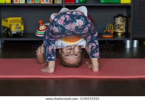 Little Girl Bending Down Making Physical Stock Photo 1540531925