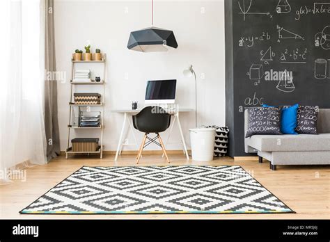 Shot Of An Elegant Student Room With A Big Blackboard And Minimalist