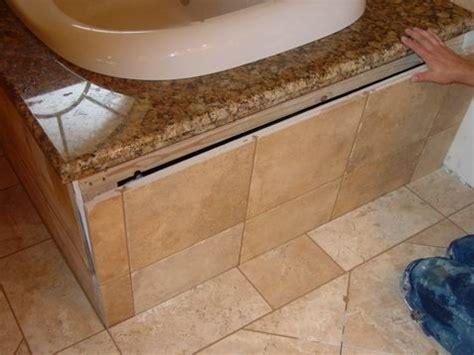 They seem to think that the panel will possible lift out from the bottom once the grout and silicone is broken. tub access panel - Google Search | Corner jacuzzi tub, Tub ...