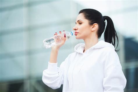 Fitness Sport And Healthy Lifestyle Concept Woman Drinking Water