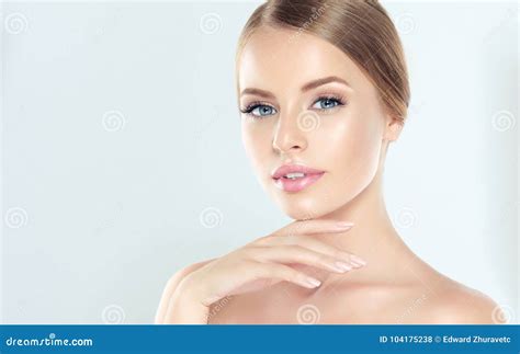 Portrait Of Young Woman With Clean Fresh Skin And Soft Delicate Make
