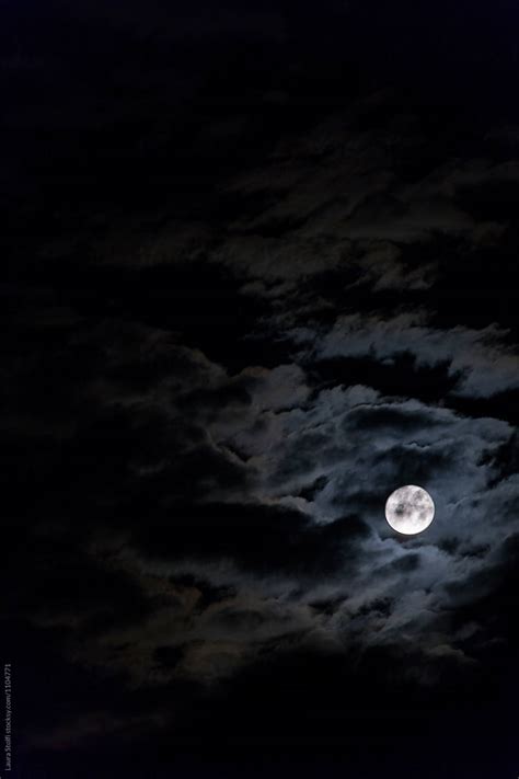 Full Moon Covered From Clouds Looking Like Smoke In Night Sky By