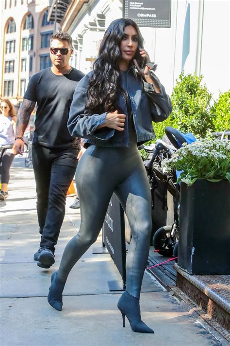 Kim Kardashian Rocks Dark Grey Leather Bodysuit With Matching Boots And