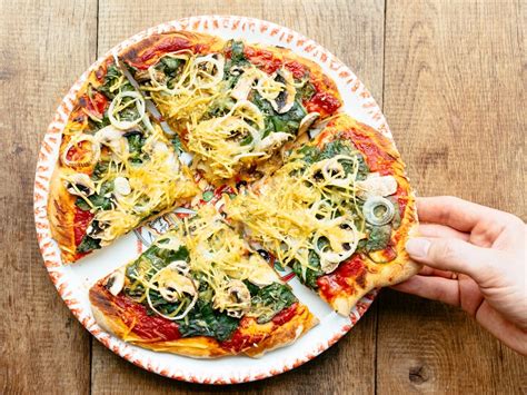 You'll know your pizza is done when the cheese turns a light golden brown color and begins to bubble steadily. 5 Chefs on How They'd Doctor Up Frozen Pizza | Glamour