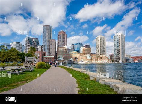 View Of The Boston Skyline And Walkway At Fan Pier Park In Boston