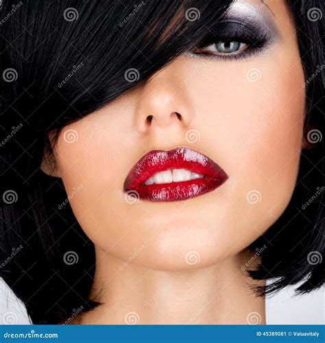 Beautiful Brunette Woman With Shot Hairstyle And Red Lips Stock Photo