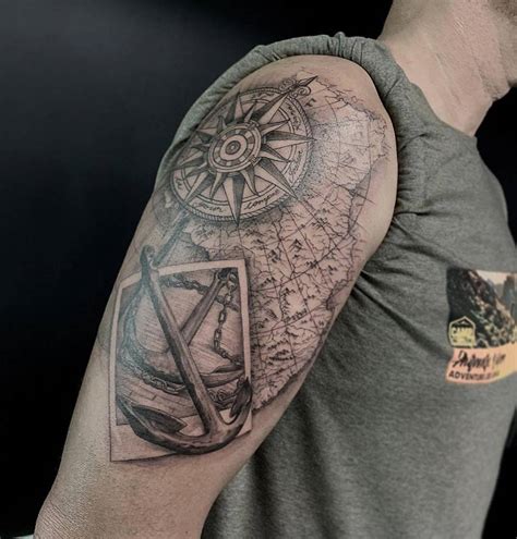 Black And Grey Anchor And Compass Rose Tattoo On The