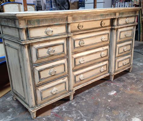 An Old Dresser Is Being Worked On In A Shop