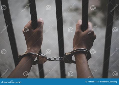 Handcuffed Hands Of A Prisoner In Prison Male Prisoners Were Severely