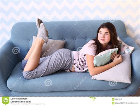 sad young girl lay  sofa stock photo cartoondealercom