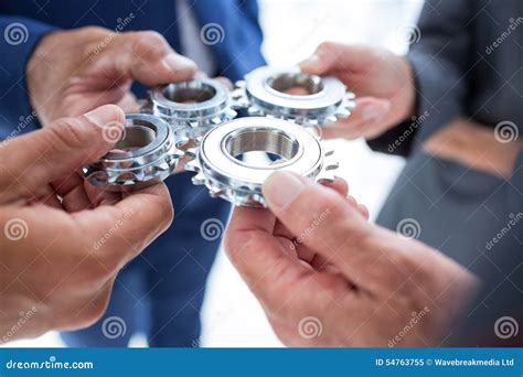 Business Colleagues Holding Cog Stock Image Image Of Piece Solution