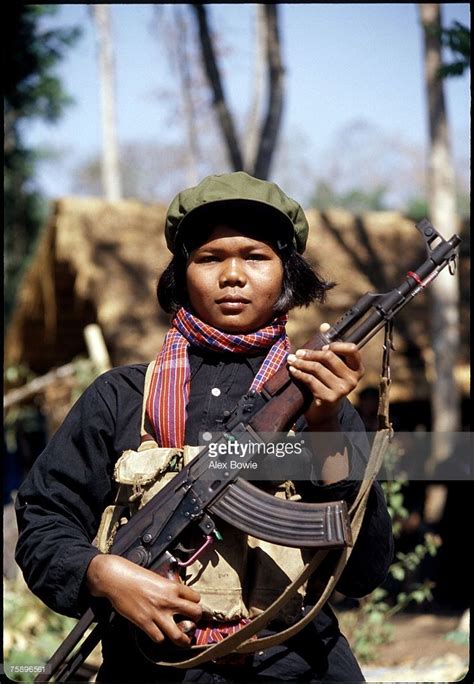 A Female Khmer Rouge Fighter Or Mit Naree Carries An Ak 47 Assault