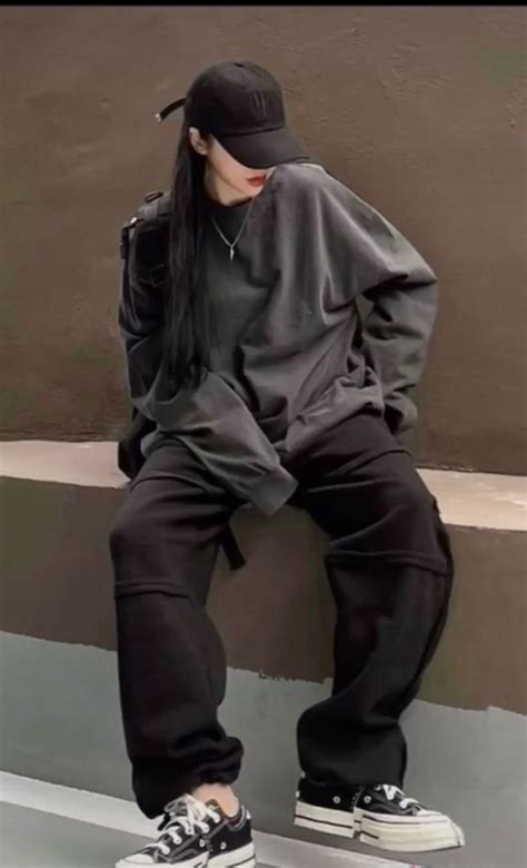 Asian Girl Wearing Black Cap Black Cargo Pants And Sneakers Korean