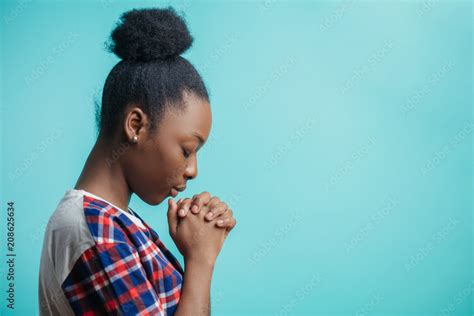 Close Up Side View Portrait Of Black Girl With Lively Faith