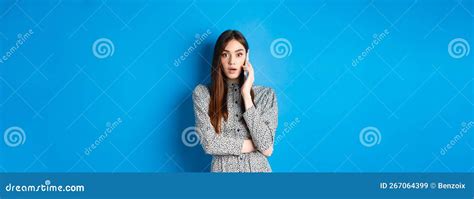 Shocked Girl Talking On Mobile Phone Gasping Amazed At Camera Speaking With Someone And Hear