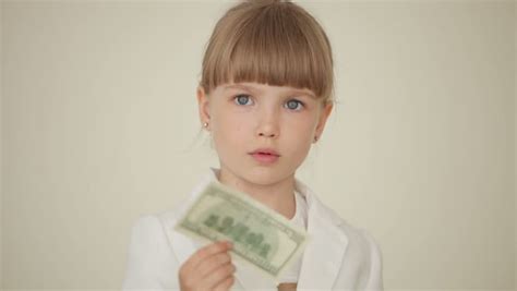 Little Girl Holding A Money Stock Footage Video 100 Royalty Free