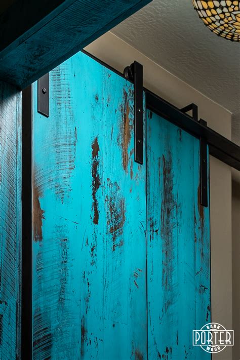 The barn door is the perfect way to bring some visual and textural beauty to a bedroom that seems all too monotonous. Teal Bypass Sliding Doors | Porter Barn Wood