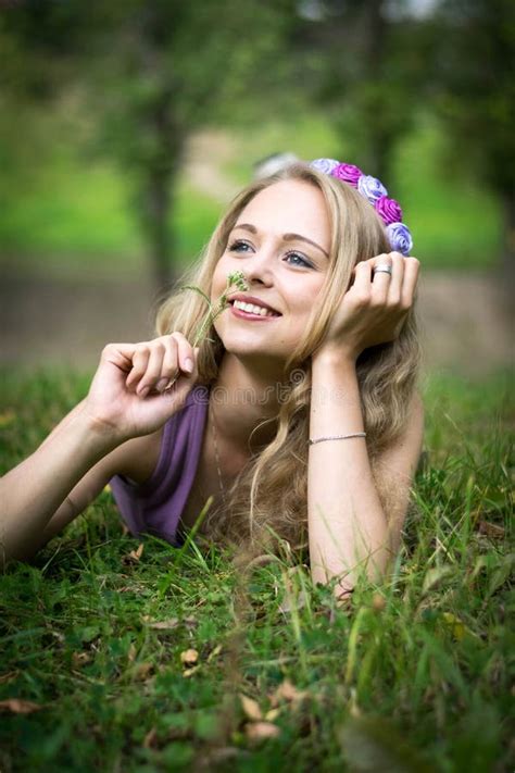 Beautiful Blonde Girl Is Lying In The Grass And Laughing Stock Image Image Of Beauty Green