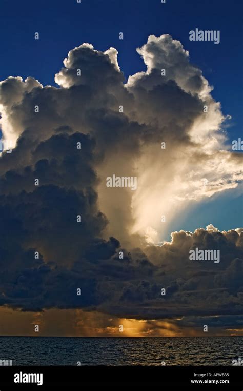 Storm Clouds At Sunset Over Ocean Stock Photo Alamy