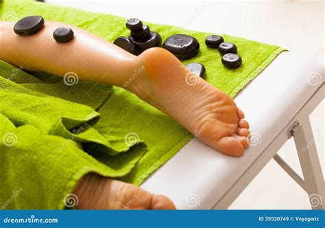 spa salon female legs having hot stone massage bodycare and relax stock image image of spa
