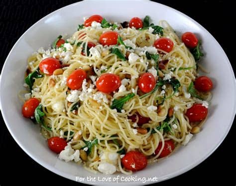 Toss the freshly cooked and drained angel hair pasta with the olive oil and garlic mixture, serve and pass the freshly grated parmesan around the table. Angel Hair Pasta with Arugula, Feta Cheese, Tomatoes, and ...