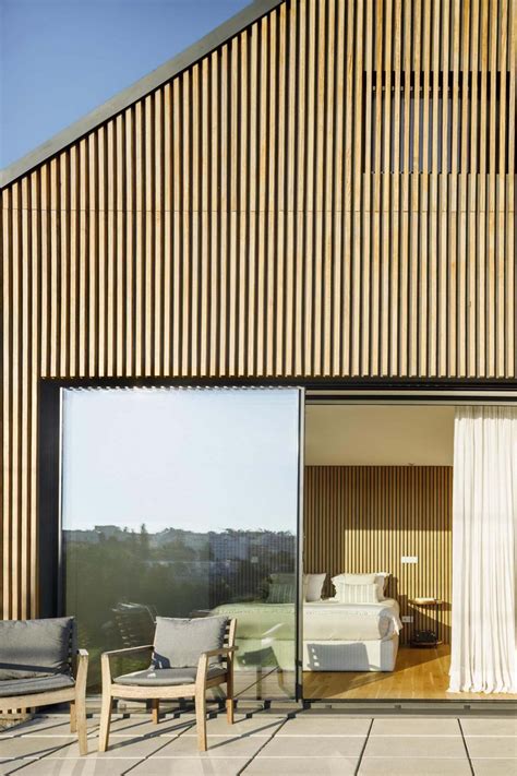 Wood Slats On The Exterior Of This House Hide Some Windows And Doors In