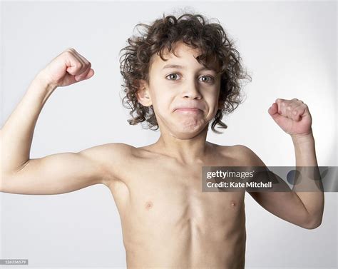 Young Boy Flexing His Muscles High Res Stock Photo Getty Images